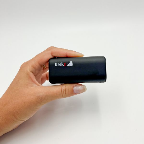 Woman holding a 5K Power Bank between her thumb and index finger